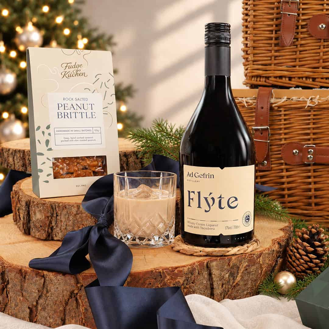 Ad Gefrin Flýte whisky cream liqueur with peanut brittle beside the Longhirst wicker baskets
